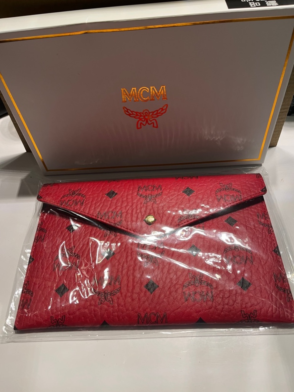 New MCM Red Logo Envelope Clutch with Black Monogram